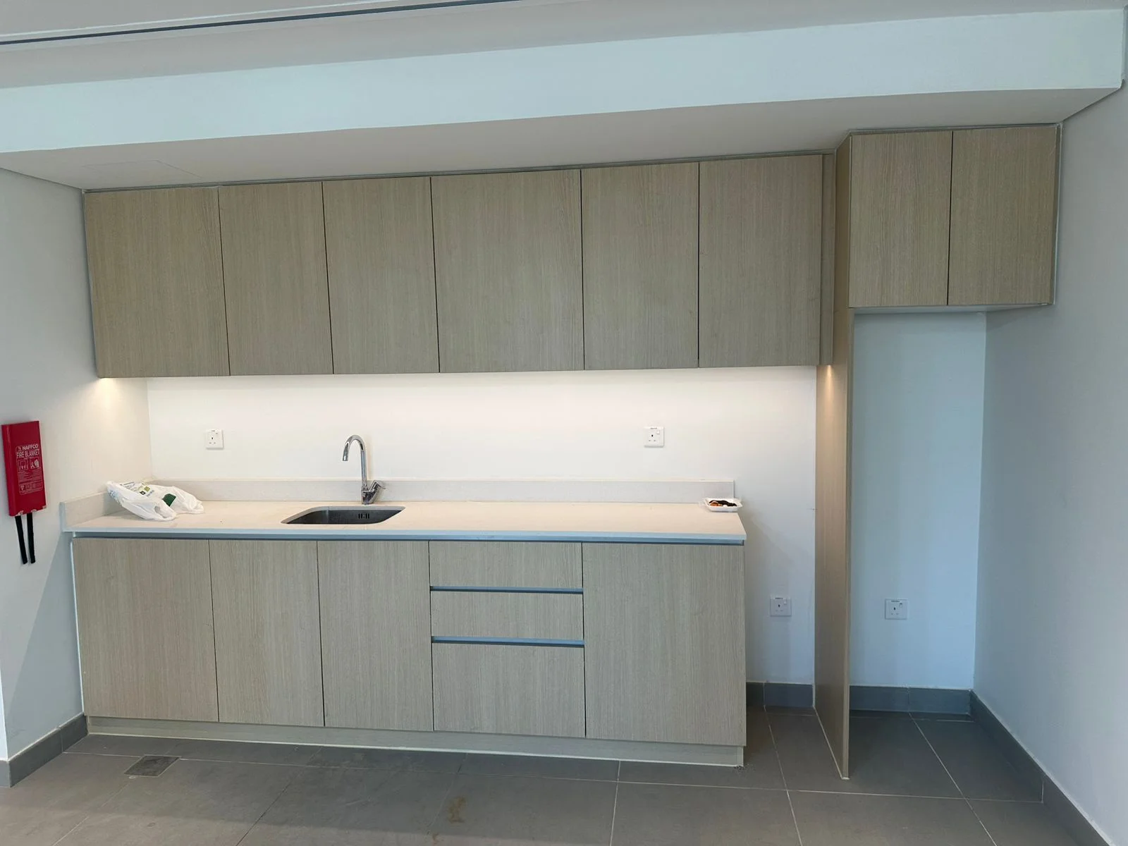 Apartment kitchenette and fitted cabinetry